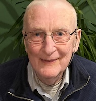 A headshot of Tony Griffin, smiling